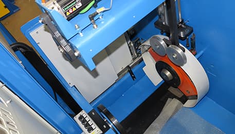 Cable manufacturing line with automated take-up system.